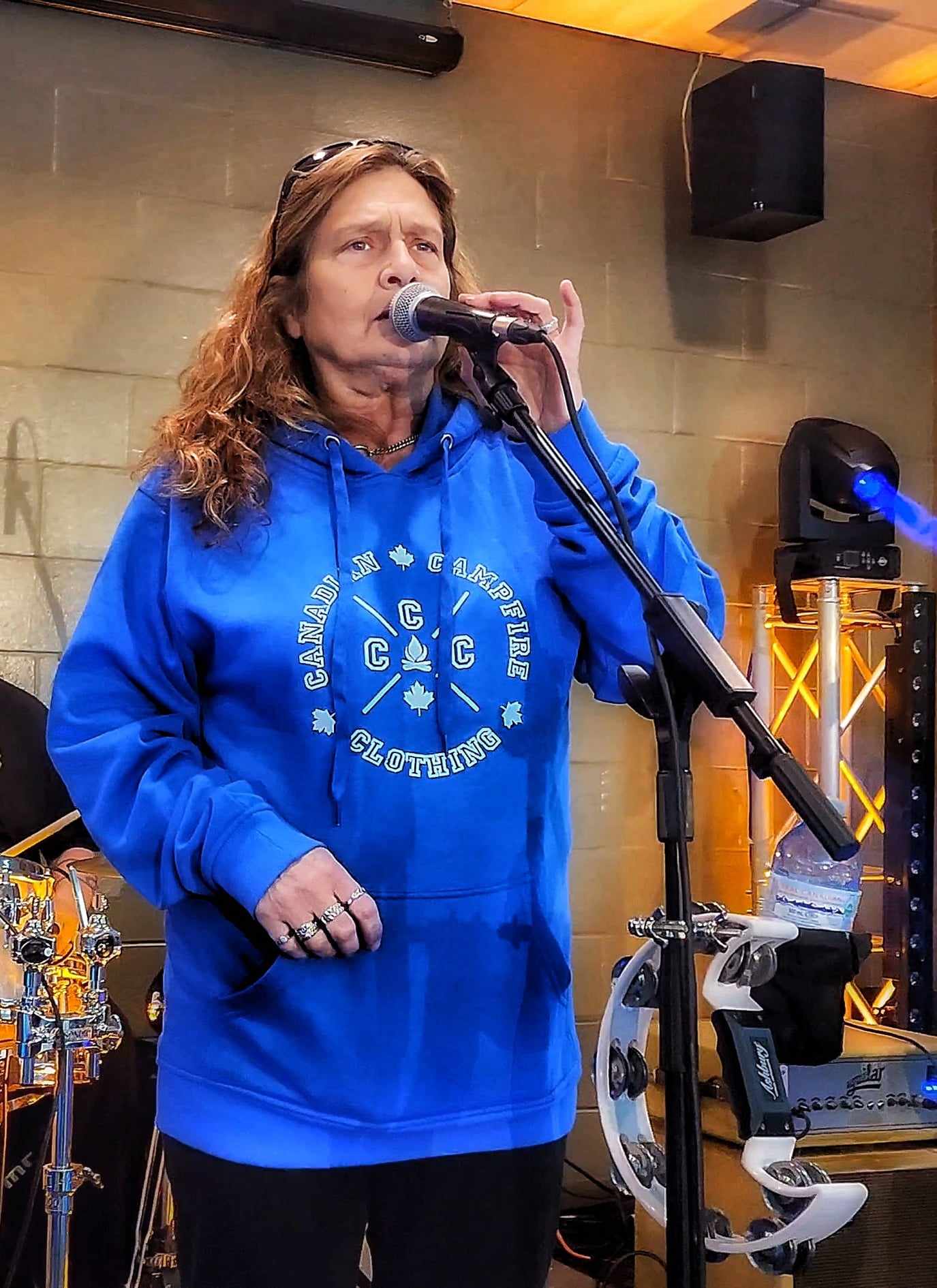 Linda from Indie Country band TATTOOS 'N WHISKEY sporting our hoodie during a sound check